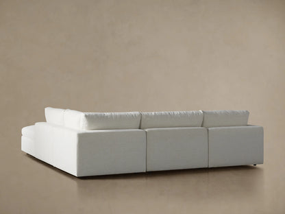 Close-up of a Beale Five Piece Sectional with a light off-white, textured back cushion and armrest, showing relaxed fabric.