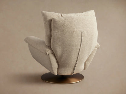 Deacon Swivel Recliner in beige fabric, shown reclined at an angle with a side lever, on a round, bronze swivel base.