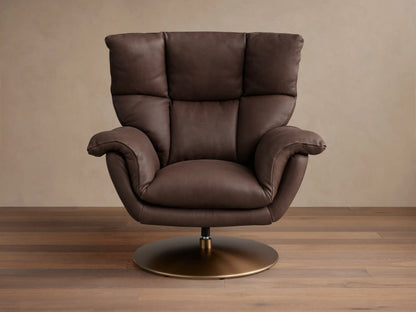 Deacon Leather Swivel Recliner in brown leather with padded armrests, tall backrest, and a brass swivel base, set on wooden floor.