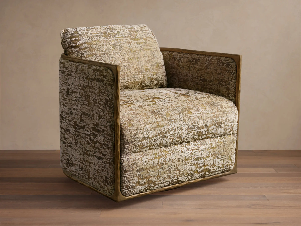Front view of the Nataly Swivel Chair with cream and olive textured upholstery and an exposed light brass frame.
