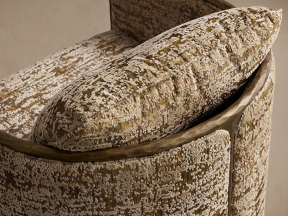 Front view of the Nataly Swivel Chair with textured greenish-gold and off-white upholstery and a hammered light brass frame.