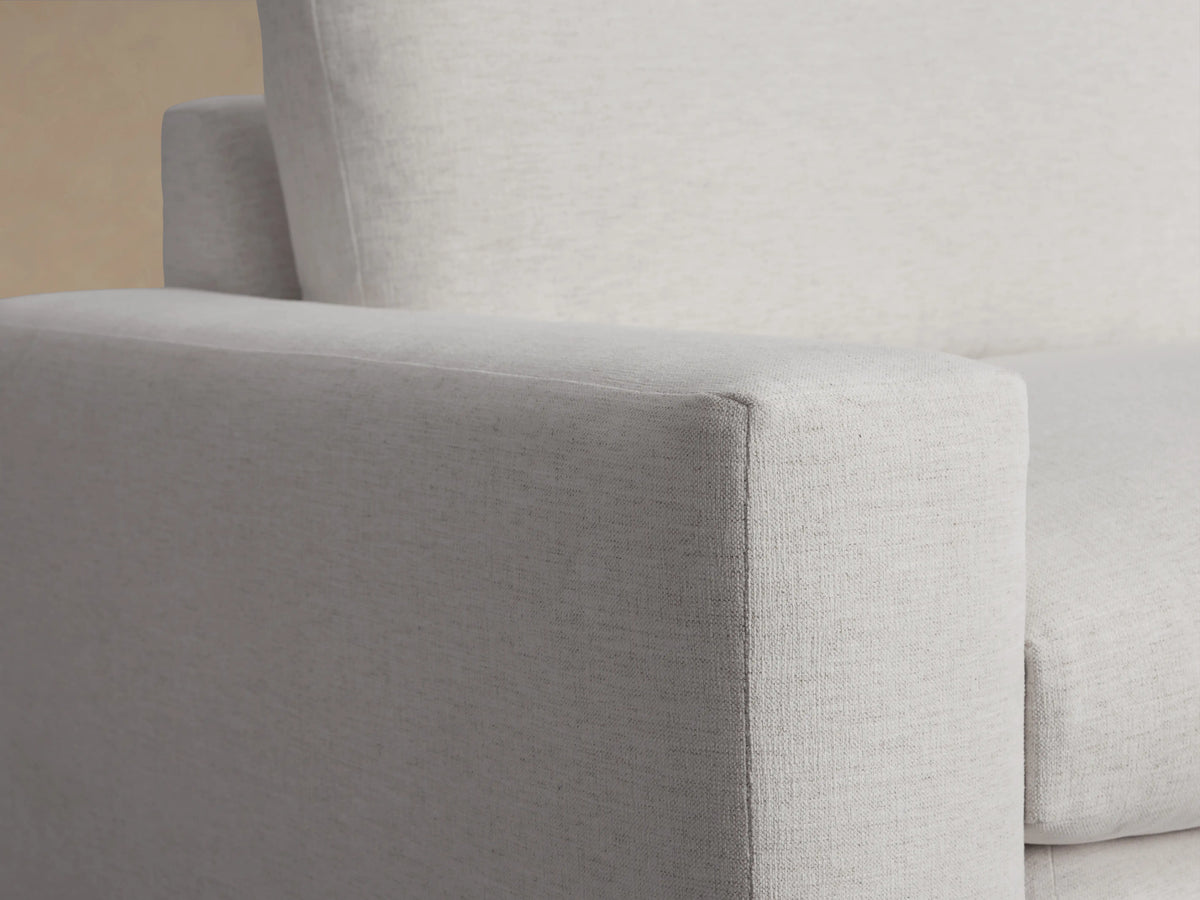 Wide arm of the Kipton Sofa in light gray fabric, showcasing smooth texture and modern design against a neutral background.