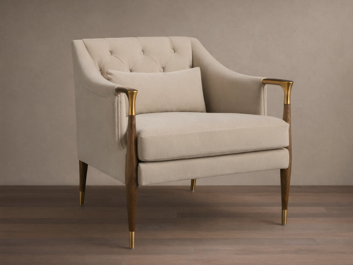 Front view of cream Fisher Club Chair with tufted back, dark wood arms and legs with brass accents, includes matching lumbar pillow.
