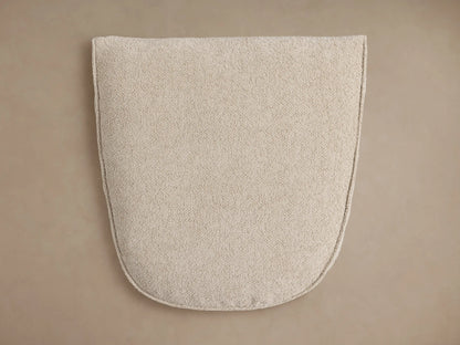 Close-up of a Giorgio Ottoman's light beige Abi Fawn Performance Fabric, showing its soft, textured surface and stitched edges.
