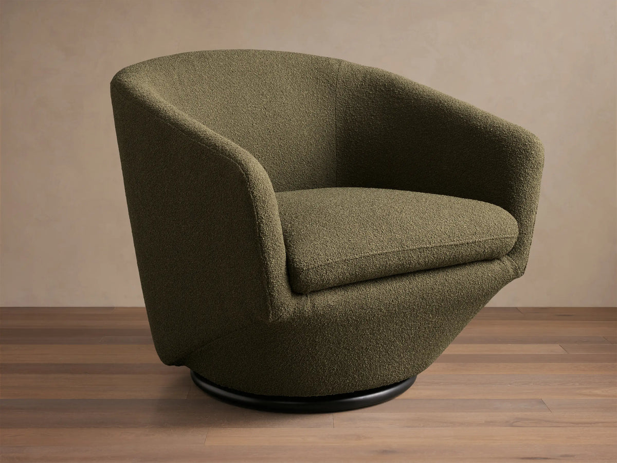 Front view of a forest green textured Pelton Swivel Chair, with a deep seat, curved arms, and a black round swivel base.