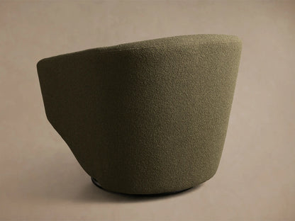 Close-up of the dark olive green bouclé fabric on the Pelton Swivel Chair, showing the curved backrest and seat cushion.