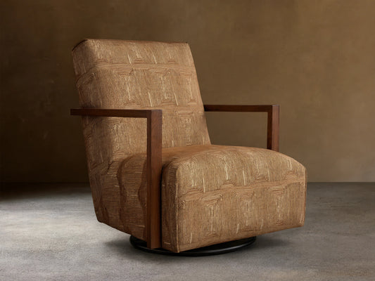 Front view of the Walsh Swivel Glider with tan geometric patterned upholstery, dark wooden armrests, and a black swivel base.