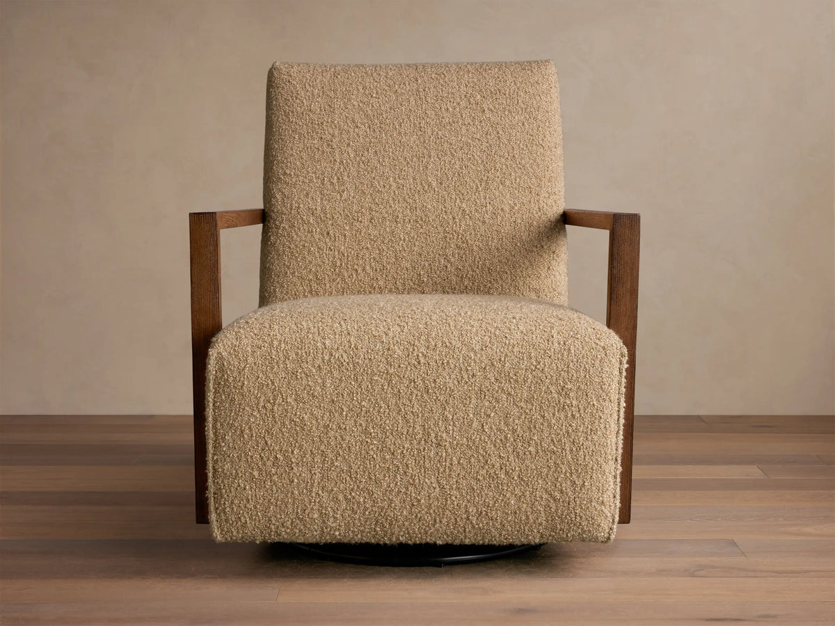 Front view of the beige textured Walsh Swivel Glider with dark brown wooden armrests and a black swivel base.