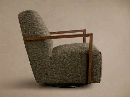 Rear view of an olive green textured Walsh Swivel Glider with dark wooden armrests and a black swivel base.