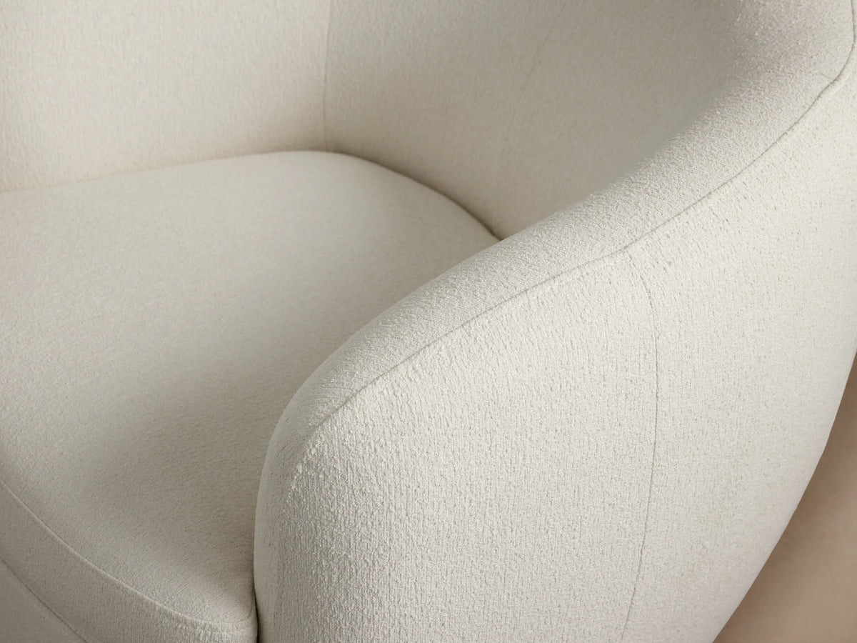 Cerrito Swivel Chair in white fabric with a curved backrest and cushioned seat, on a dark round swivel base.