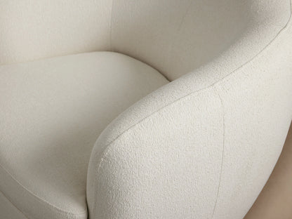 Cerrito Swivel Chair in white fabric with a curved backrest and cushioned seat, on a dark round swivel base.