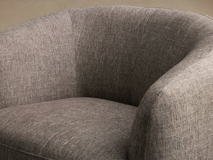 Cerrito Swivel Chair in gray fabric, featuring curved backrest and cushioned seat, on a wooden swivel base, set against a wood floor.