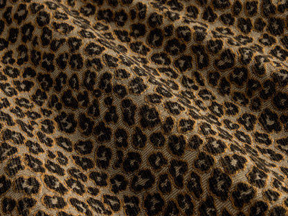 Close-up of the taupe, black, and tan leopard print jacquard weave fabric on the Cerrito Swivel Chair.
