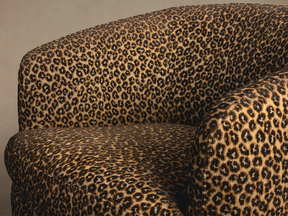 Close-up of the tan and brown leopard print upholstery on the Cerrito Swivel Chair.