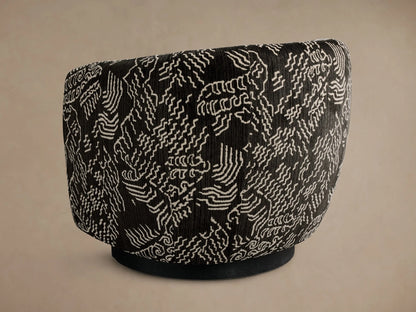 Side view of the black Cerrito Swivel Chair featuring a white abstract wavy line pattern and a black swivel base.