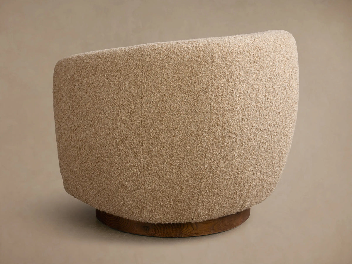 Close-up of the beige boucle fabric on the Cerrito Swivel Chair, showing its curved form.