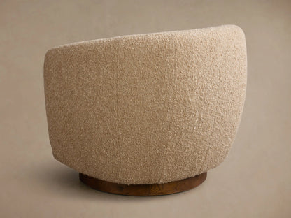 Close-up of the beige boucle fabric on the Cerrito Swivel Chair, showing its curved form.