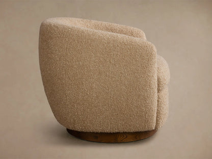 Rear view of the beige boucle Cerrito Swivel Chair, with a curved back and round wooden base.