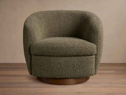 Front view of an olive green bouclv© Cerrito Swivel Chair with a rounded silhouette and a dark wooden swivel base.