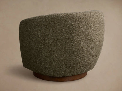 Close-up of the moss green textured upholstery fabric of the Cerrito Swivel Chair, showing its soft, looped surface.