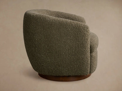 Rear view of the olive green textured Cerrito Swivel Chair with a round wooden swivel base.