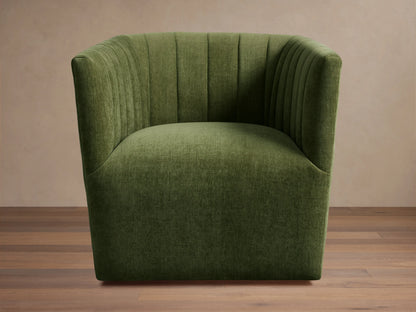 Green Griffin Swivel Chair with a rounded back and vertical channel tufting, set on a wooden floor.