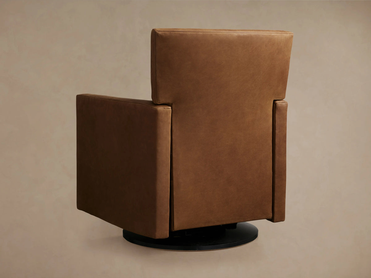 Rudy Leather Swivel Recliner in brown leather, side view. Features straight back, cushioned seat, and black swivel base on neutral background.