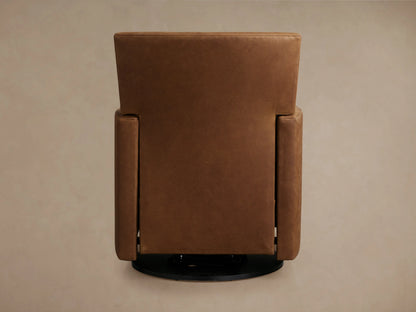 Rudy Leather Swivel Recliner in brown leather, viewed from the back, showing a tall rectangular backrest and straight arms on a circular black base.