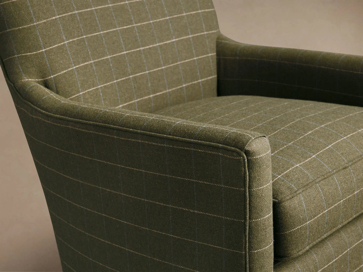Front view of the green windowpane plaid Walton Swivel Glider, featuring a high back and sloped arms.