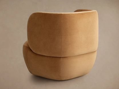 Brown Lenny Swivel Chair close-up, showing soft, rounded armrest and seat cushion with smooth fabric texture.