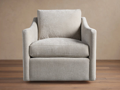 Branson Swivel Chair in beige fabric, features plush seat and back cushions, flared arms, on hardwood floor, against tan background.