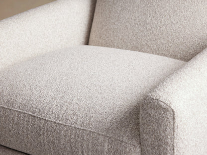 Harvey Swivel Recliner in light gray speckled fabric, upright and seen front-on against a light brown wall and wooden floor.
