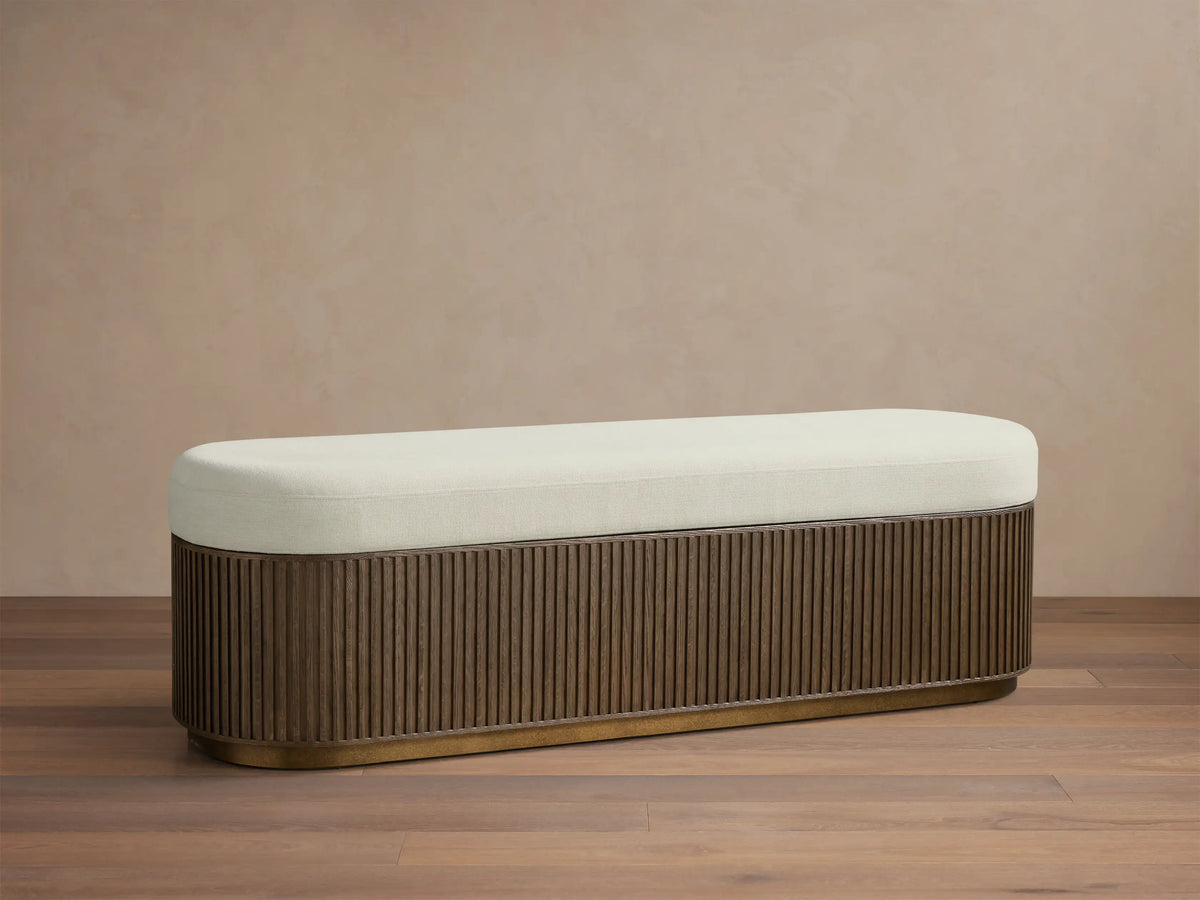 Interior view of the Finnley Storage Bench with its cream upholstered lid open, revealing a light brown wooden interior and ribbed exterior.