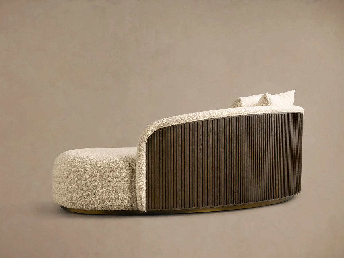 Rear view of the cream Finnley Daybed with an ebony slatted wood back and two matching throw pillows.