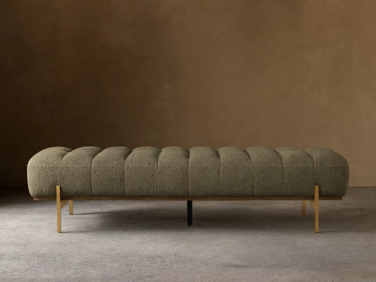 Front view of the olive green Lansing Bench, featuring channel-tufted upholstery and slender gold-colored metal legs.