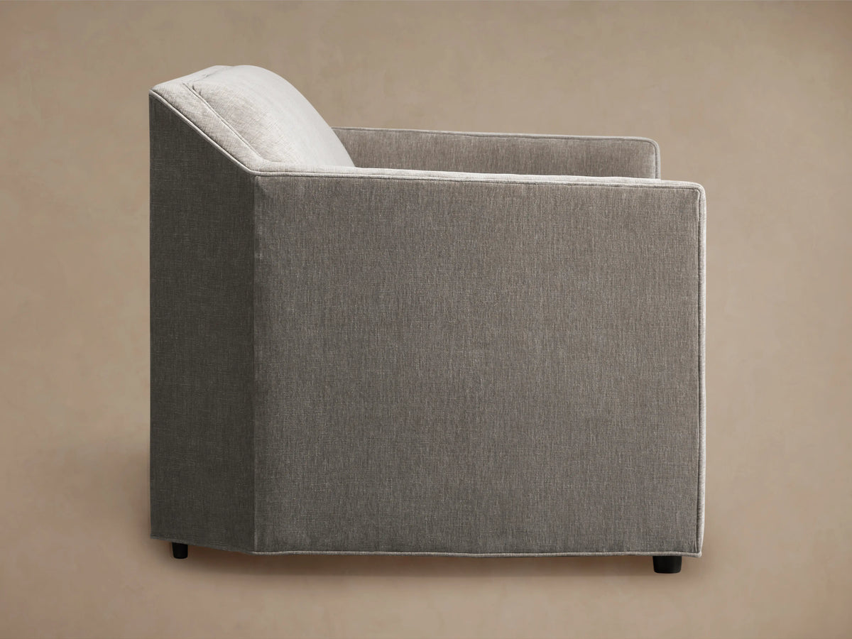 Marina Sofa in gray fabric, featuring a modern, angular design with a cushioned seat and backrest, shown against a neutral background.