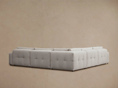 Keegan Five-Piece Corner Sectional in light gray fabric, showing close-up of the textured upholstery and plush cushions against a neutral background.