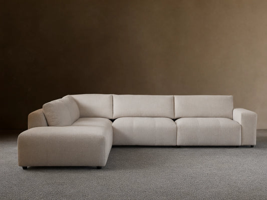 Keegan Five-Piece Corner Sectional in light gray fabric, featuring a modern design with plush seat and back cushions, set on a wooden floor.