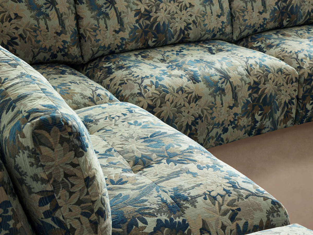 Keegan Five-Piece Sectional, L-shaped with chaise, in blue and green botanical print fabric, on wood floor.