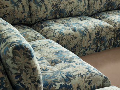 Keegan Five-Piece Sectional, L-shaped with chaise, in blue and green botanical print fabric, on wood floor.