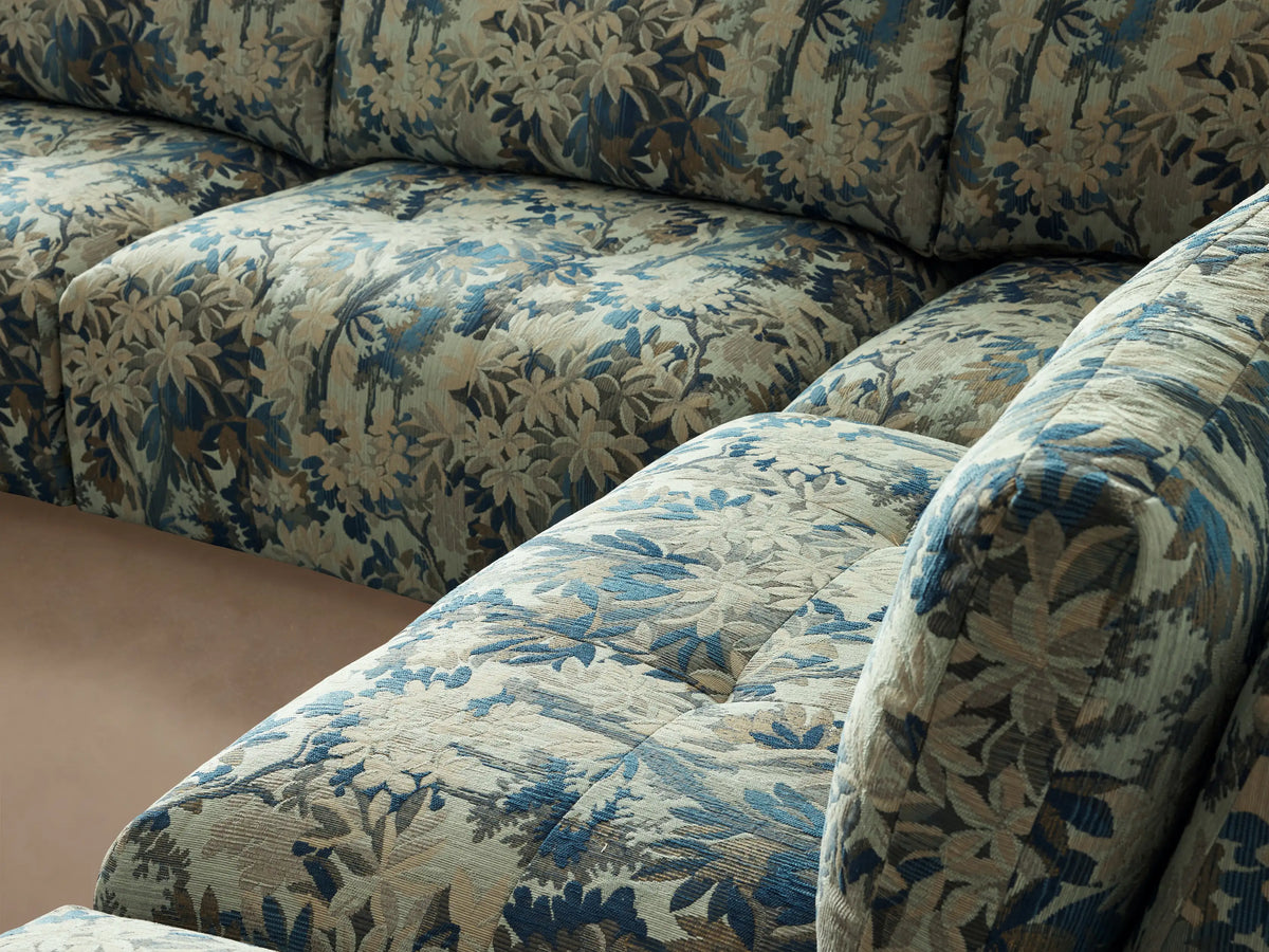 Keegan Five-Piece Sectional, L-shaped, in blue & green botanical print fabric, on a wooden floor.