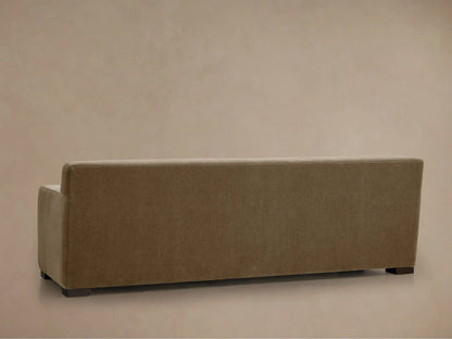 Close-up of Bronte Sofa's textured brown fabric armrest and seat, angled view showing soft, muted color and detailed stitching.
