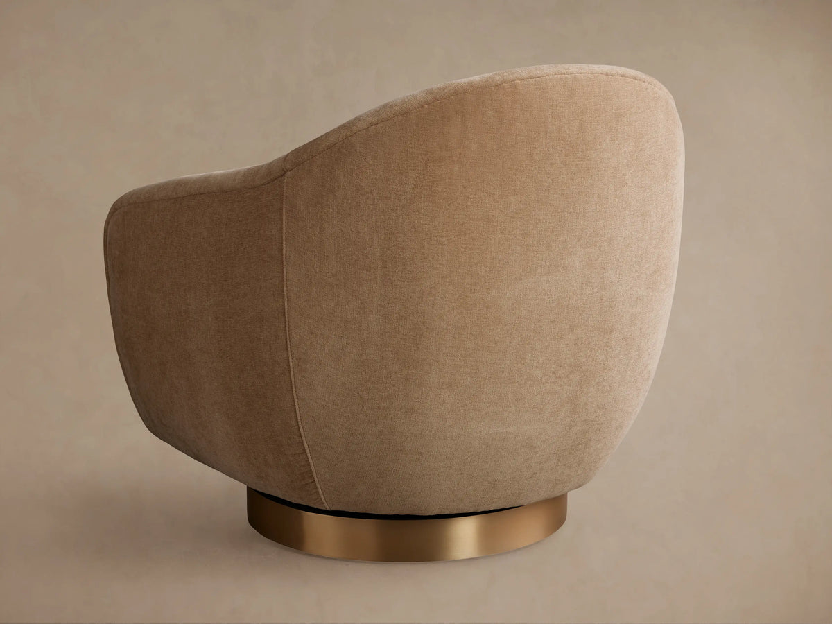 Close-up of the Ashbury Swivel Chair in light beige textured fabric, showing rounded back, arms, and seat cushion.