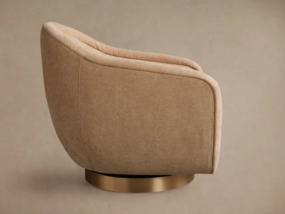 Ashbury Swivel Chair, back 3/4 view. Rounded beige upholstered chair with textured fabric and a gold metallic swivel base.
