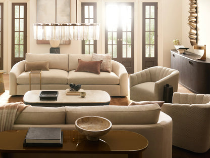 Light cream Ellison Channel-Stitched Swivel Chair, front-right view. Channel stitching on back, black swivel base on wood floor.