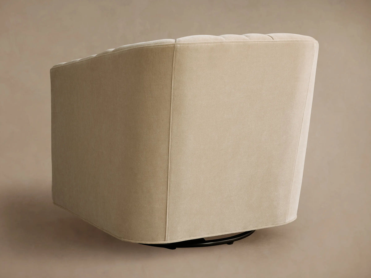 Ellison Channel-Stitched Swivel Chair in light beige, close-up. Curved backrest features vertical channel stitching.