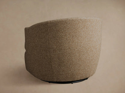 Kieran Swivel Chair in beige textured fabric, shown from a side angle, featuring a rounded back and cushioned seat on a swivel base.