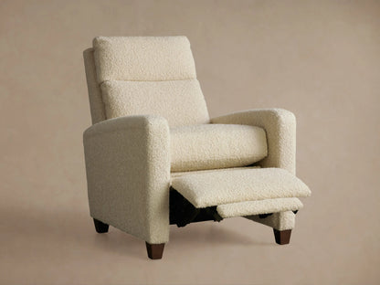 Colfax Motion Recliner in full recline, side view. Cream bouclé fabric, extended footrest, dark wood legs.