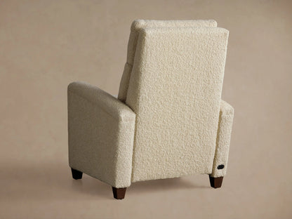 Colfax Motion Recliner, cream boucle fabric, partially reclined with footrest up, angled left on a tan background.