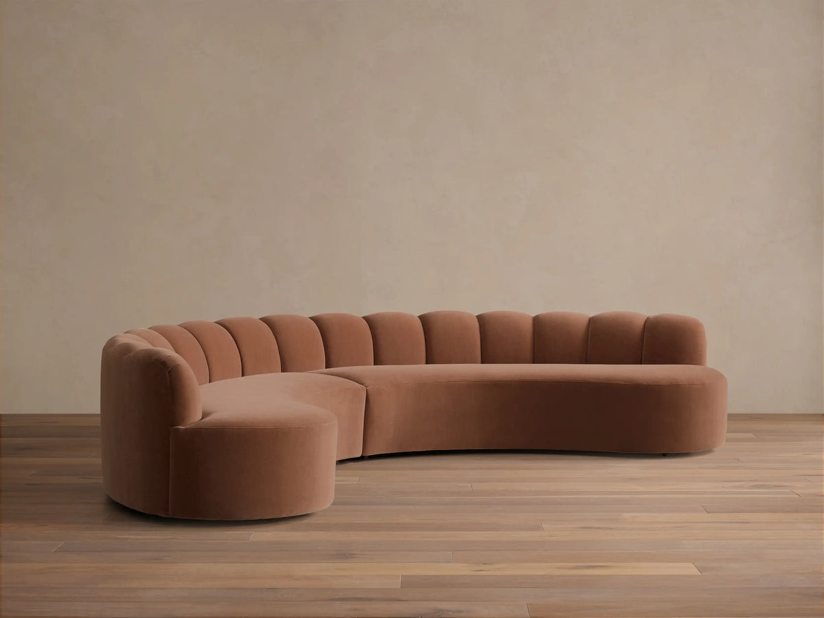 Front view of the Dusty Rose Amira Two-Piece Curved Sectional with channel tufting on the backrest.